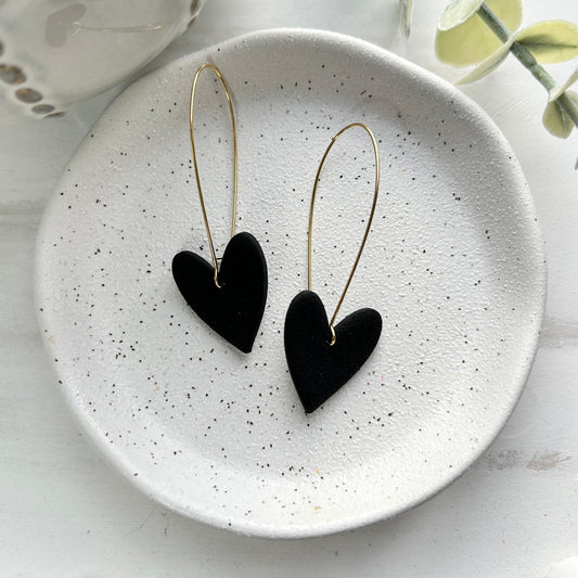 Valentine’s Collection black polymer clay heart earrings on a long, gold coloured kidney wire