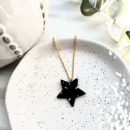 Stunning black and gold polymer clay star necklace on an 18 inch gold plated chain